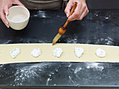 Preparing filled pasta: brush pastry edges