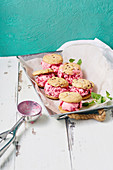 Raspberry ice cream sandwiches with chocolate chip cookies
