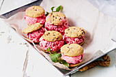 Raspberry ice cream sandwiches with chocolate chip cookies