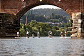 Stand-up paddling on the Mosel, Römerbrücke, Trier, Rhineland-Palatinate, Germany