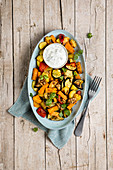 Baked vegetables with herb yogurt and caramelized walnuts