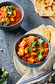 Sweet potatoes with potatoes, lentils and tomatoes, with flat bread