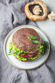 Portobello mushroom bun burger with beetroot cutlet. Vegan, gluten free burger