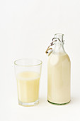 Rice milk in a glass and flip-top bottle