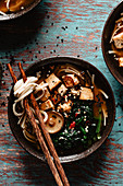Asian miso soup with mushrooms into a bowl