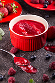 Berries sorbet (raspberry, blueberry, strawberry) in red crockery