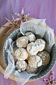 Gluten-free snowball cookies dusted with icing sugar and with beaded stars