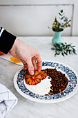 Espresso and chocolate granola bowl with yoghurt and blood oranges
