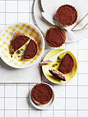 Chocolate mousse and pistachio and orange tartlets