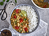 Chickpea curry with cocktail tomatoes served with rice