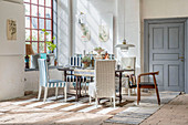 Various chairs around table in Mediterranean dining room