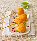 Fish ball aperitif, with a pea and mint dip