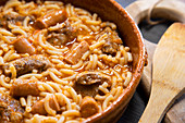 Spanish fideos a la cazuela with pork sausages and ribbs
