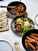 Mexican fajitas meal with dishes to make your own tacos