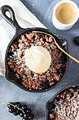 Chocolate crumble with berries and vanilla ice cream