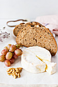 Bread, camembert, grapes and nuts