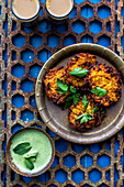 Onion baji (Indian onion fritters) with mint dip
