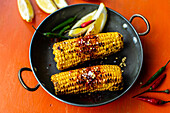 Bhutta (grilled corn on the cob, India)