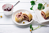 Swiss roll filled with sweet cherry jam