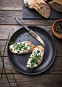Spelt baguette with almond cream cheese and chives