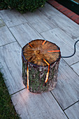 DIY tree-stump lamp in style of Swedish fire torch