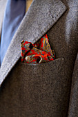 A tailored men's jacket with a pocket square