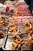 Starfish on skewers at Chinese market