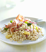 Grain salad with asparagus and cured ham