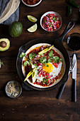 Huevos rancheros (Mexican breakfast dish with fried egg)