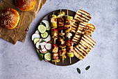 Chicken skewers with grilled halloumi cheese and fresh salad