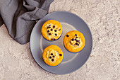 Small pumpkin cheesecakes with chocolate drops