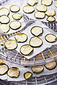 Courgette slices being dried in a dehydrator