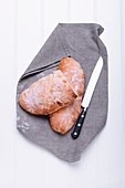Ciabatta on a cloth napkin with a knife