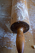 A Floured Rolling Pin with Red Handles