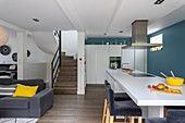 Kitchen island with table extension in open-plan interior