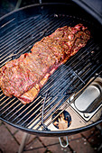 Marinated beef ribs on a grill