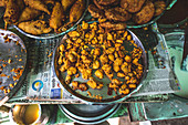 A shelf of street food snacks (India)