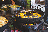 Samosa being made as street food, India