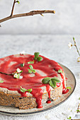 Poppy seed cheesecake with strawberry sauce