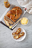 Plaited fruit loaf and toast with butter