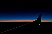 View from passenger jet at sunset