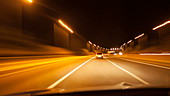Car driving at night, point of view shot