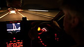 Car driving at night, point of view shot