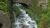 Rog waterfall under bridge in Croatia