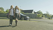 Schoolgirls walking to school, slo-mo