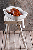 Roasted duck in baking dish