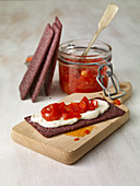 Crispbread made from black rice with soya sour cream and a pepper and tomato salsa