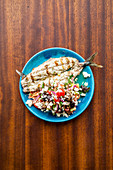 Grilled fish with Cretan rusk salad with tomato, oregano and feta