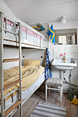 Bunk beds and sink in small shabby-chic room