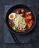Spicy tomato ramen with kimchi and meatballs
